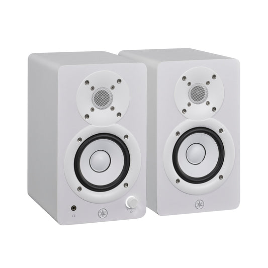 Yamaha HS3 powered studio monitors in white, angled pair view, with the left speaker's front volume knob and headphone jack