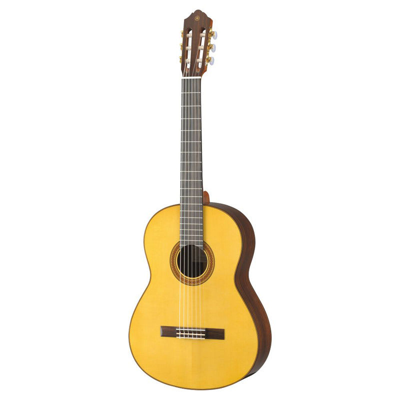 Yamaha CG182S classical guitar, front view showing the solid spruce top, ornate wooden rosette, rosewood sides, ebony fingerboard and slotted headstock with gold tuners