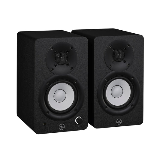 Yamaha HS3 powered studio monitors in black, angled pair view, with white cones and the left speaker's front volume knob and headphone jack