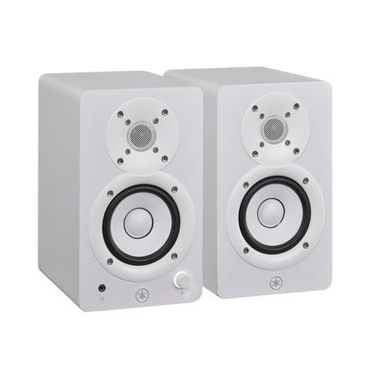 Yamaha HS3 powered studio monitors in white, angled pair view, with the left speaker's front volume knob and headphone jack