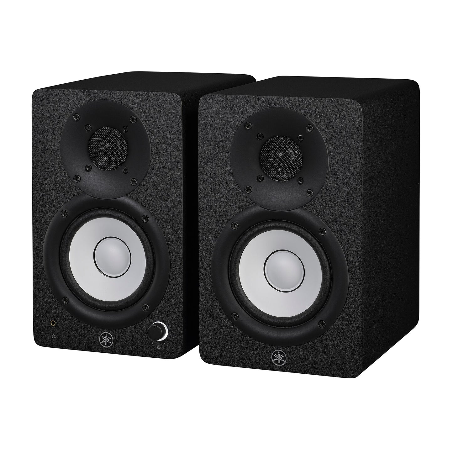 Yamaha HS4 powered studio monitors in black, angled pair view showing the left speaker's front volume knob and headphone jack
