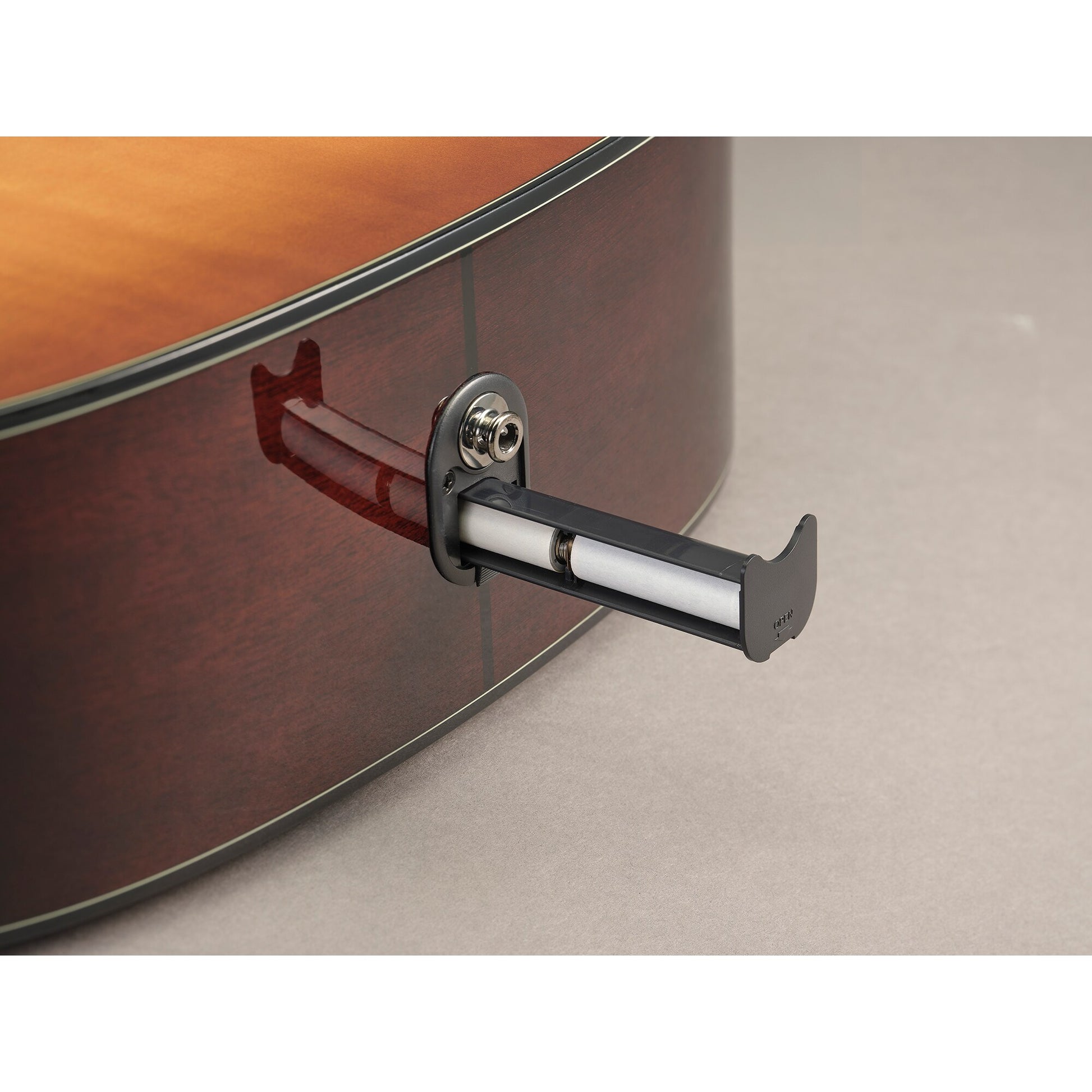 Battery holder and LINE OUT end-pin jack on the Yamaha TAG1E in Sand Burst