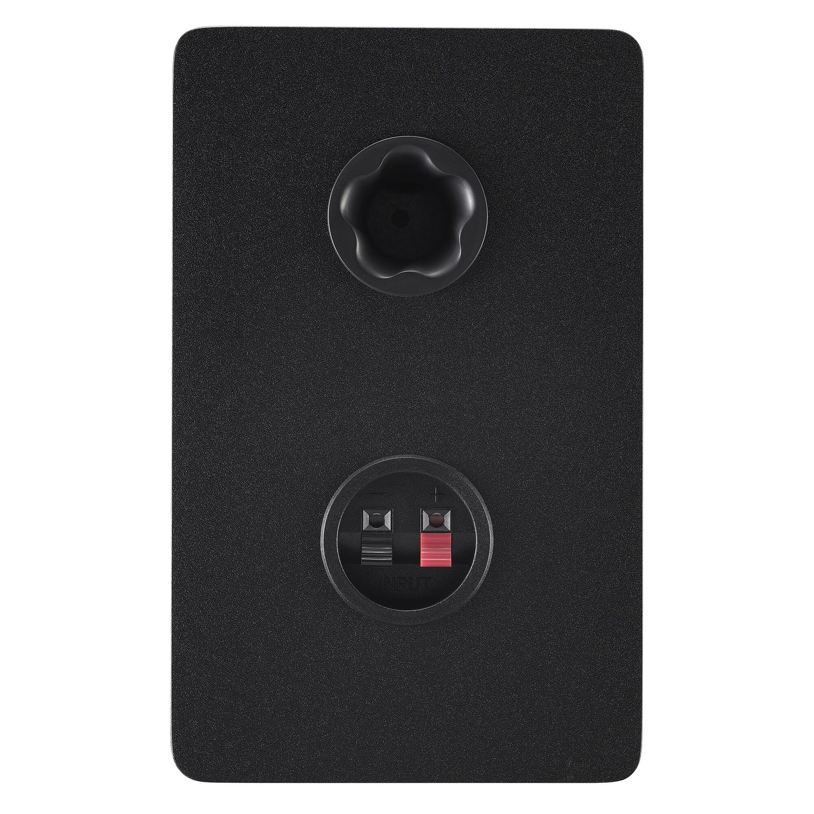 Rear panel of the black Yamaha HS4 right speaker, showing the bass-reflex port and the terminals that connect it to the powered left speaker