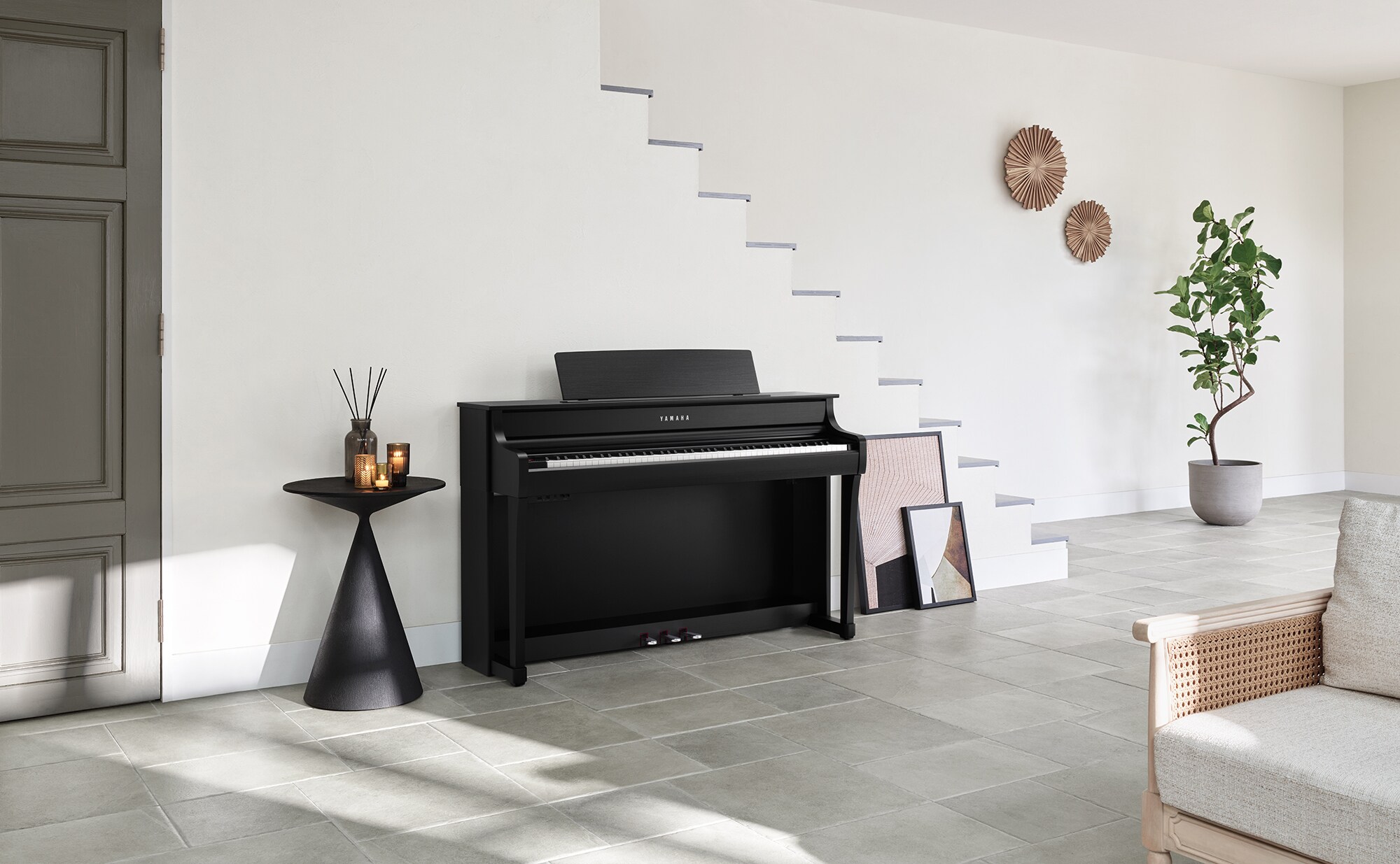 Yamaha Clavinova CLP-800 series console piano in Black, a finish offered for the CLP-845, in a living room