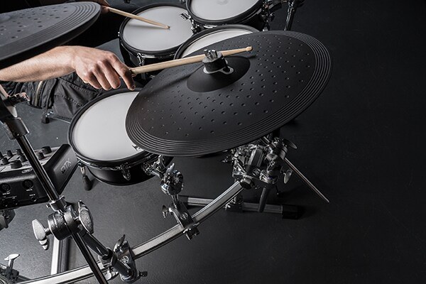 Drummer playing the three-zone cymbal pads of a Yamaha DTX10 electronic drum kit