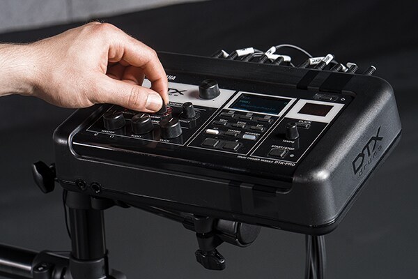 Hand adjusting the KIT MODIFIER knobs on the Yamaha DTX-PRO module of a DTX8 kit
